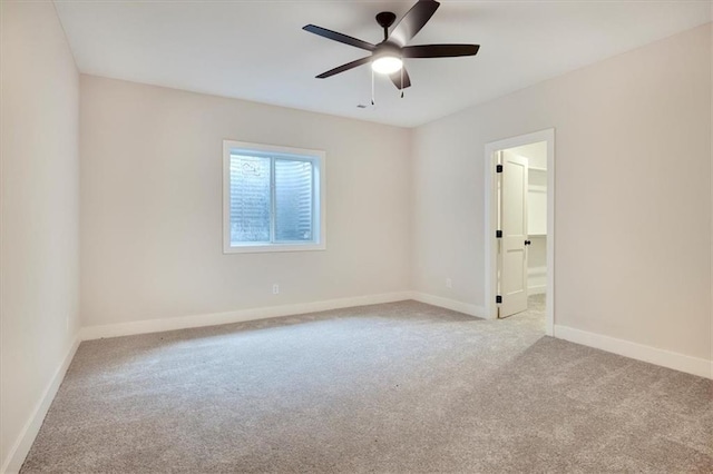 empty room with light carpet and ceiling fan