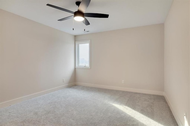 unfurnished room featuring carpet floors and ceiling fan