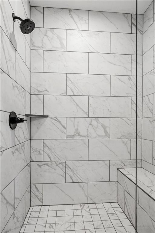 bathroom with a tile shower