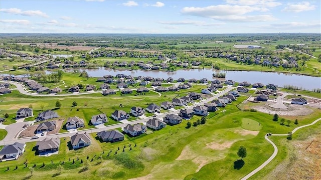 birds eye view of property with a water view, view of golf course, and a residential view