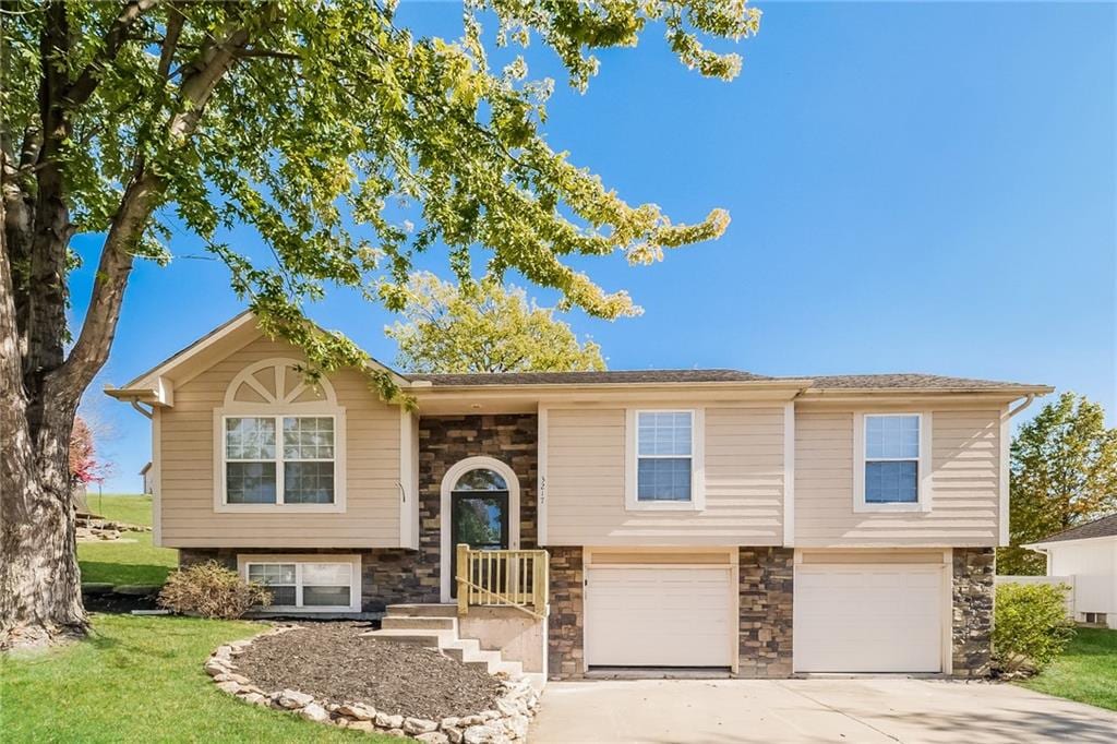 split foyer home featuring a garage