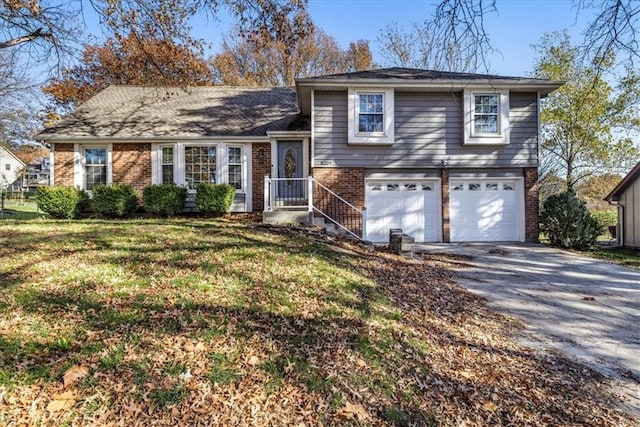 tri-level home featuring a garage and a front lawn