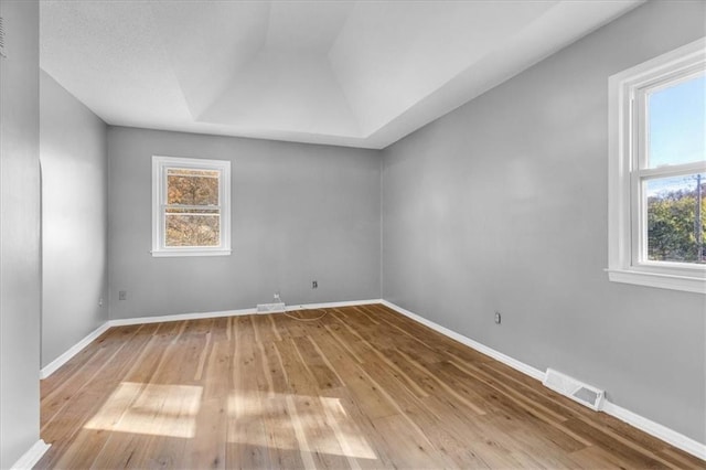 empty room featuring hardwood / wood-style flooring