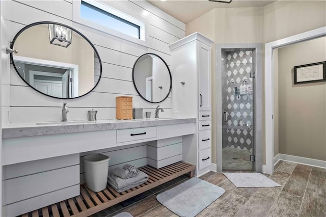 bathroom with vanity and a shower with shower door