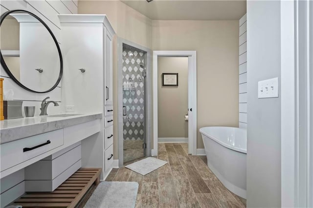 bathroom with separate shower and tub and vanity