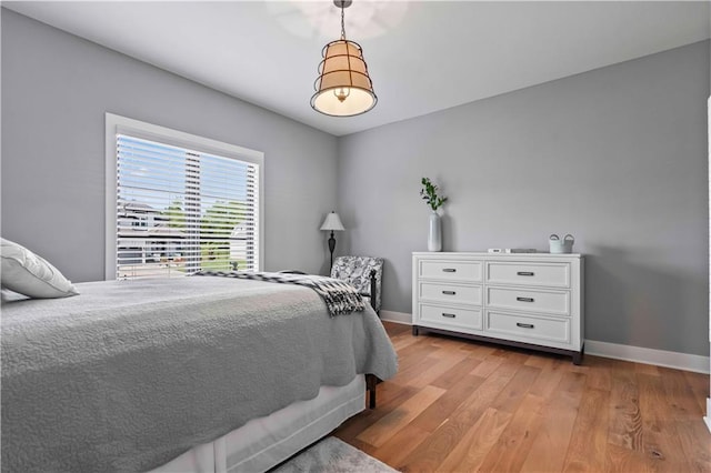 bedroom with light hardwood / wood-style floors