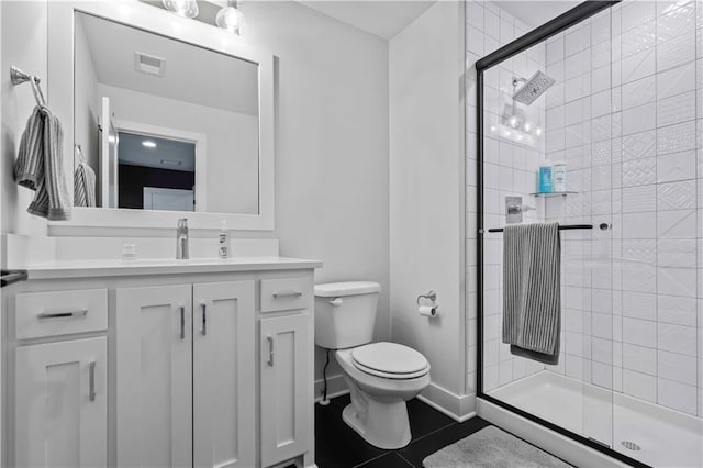 bathroom featuring walk in shower, tile patterned floors, vanity, and toilet