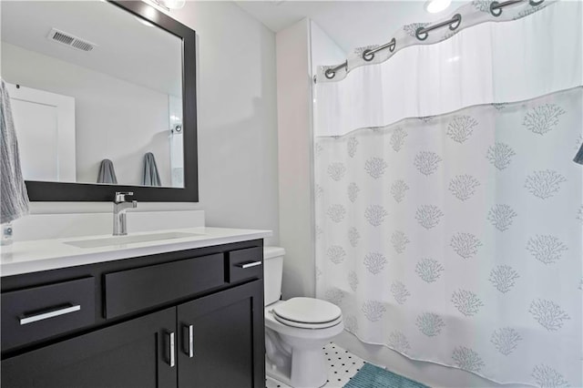 full bathroom with toilet, tile patterned flooring, shower / tub combo with curtain, and vanity