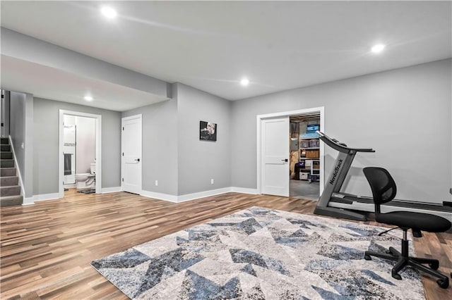 workout area featuring hardwood / wood-style flooring