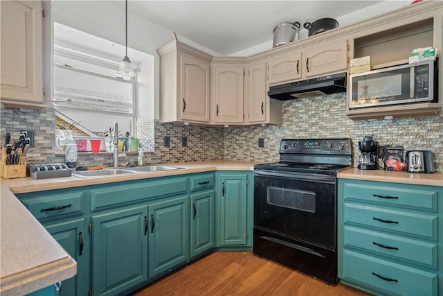 kitchen featuring black range with electric cooktop, sink, decorative light fixtures, light hardwood / wood-style floors, and tasteful backsplash