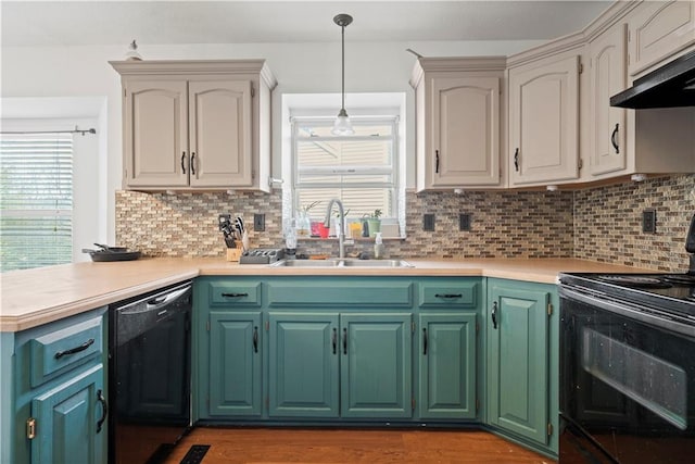 kitchen with hanging light fixtures, backsplash, black appliances, range hood, and sink