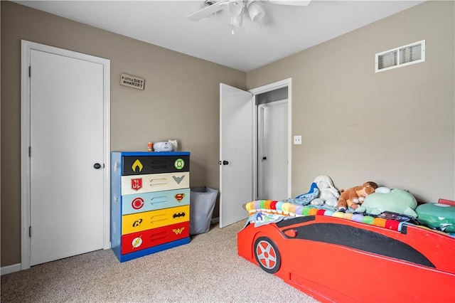 bedroom with ceiling fan and carpet floors