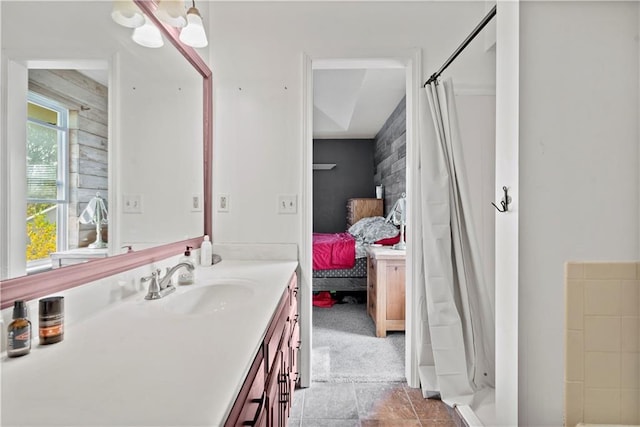 bathroom featuring vanity, a shower with curtain, and tile patterned flooring