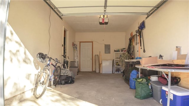 garage featuring electric panel and a garage door opener