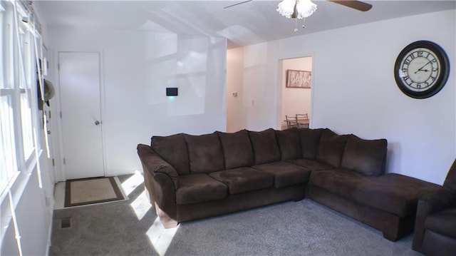 living room with ceiling fan and light carpet