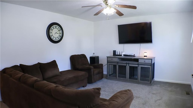 living room featuring light colored carpet and ceiling fan