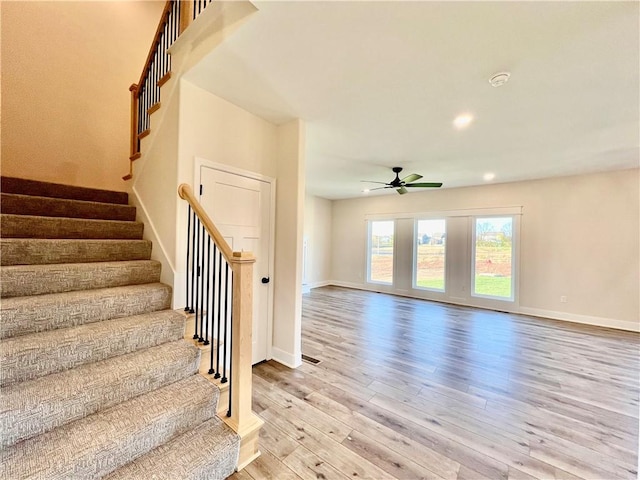 interior space with hardwood / wood-style flooring and ceiling fan