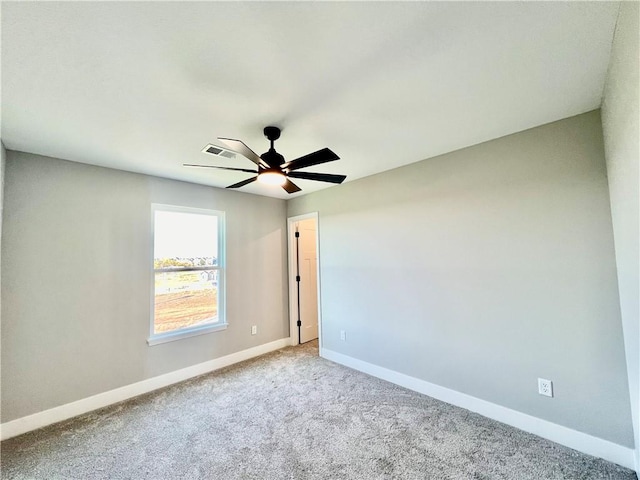 carpeted empty room featuring ceiling fan