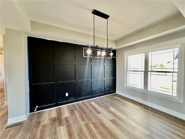 unfurnished dining area with light hardwood / wood-style floors