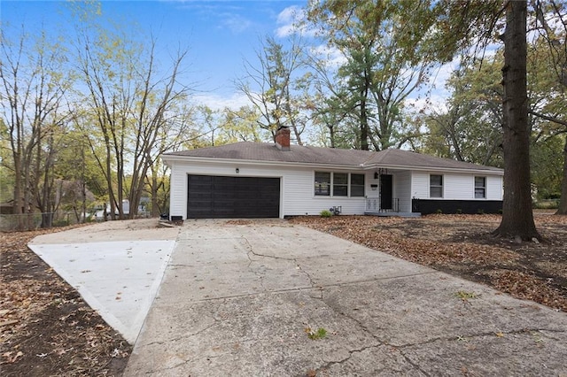 ranch-style house featuring a garage