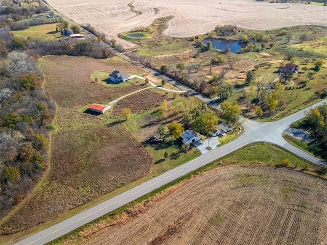 bird's eye view with a rural view and a water view