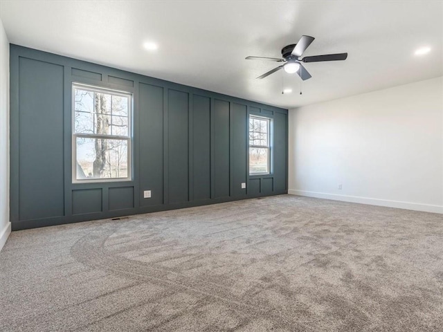 carpeted empty room with ceiling fan