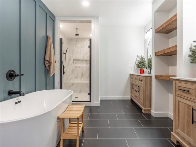 bathroom with tile patterned floors, vanity, and shower with separate bathtub