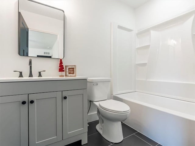 full bathroom with tile patterned flooring, vanity, tub / shower combination, and toilet