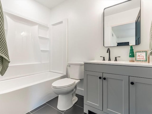 full bathroom featuring tile patterned floors, vanity, bathtub / shower combination, and toilet