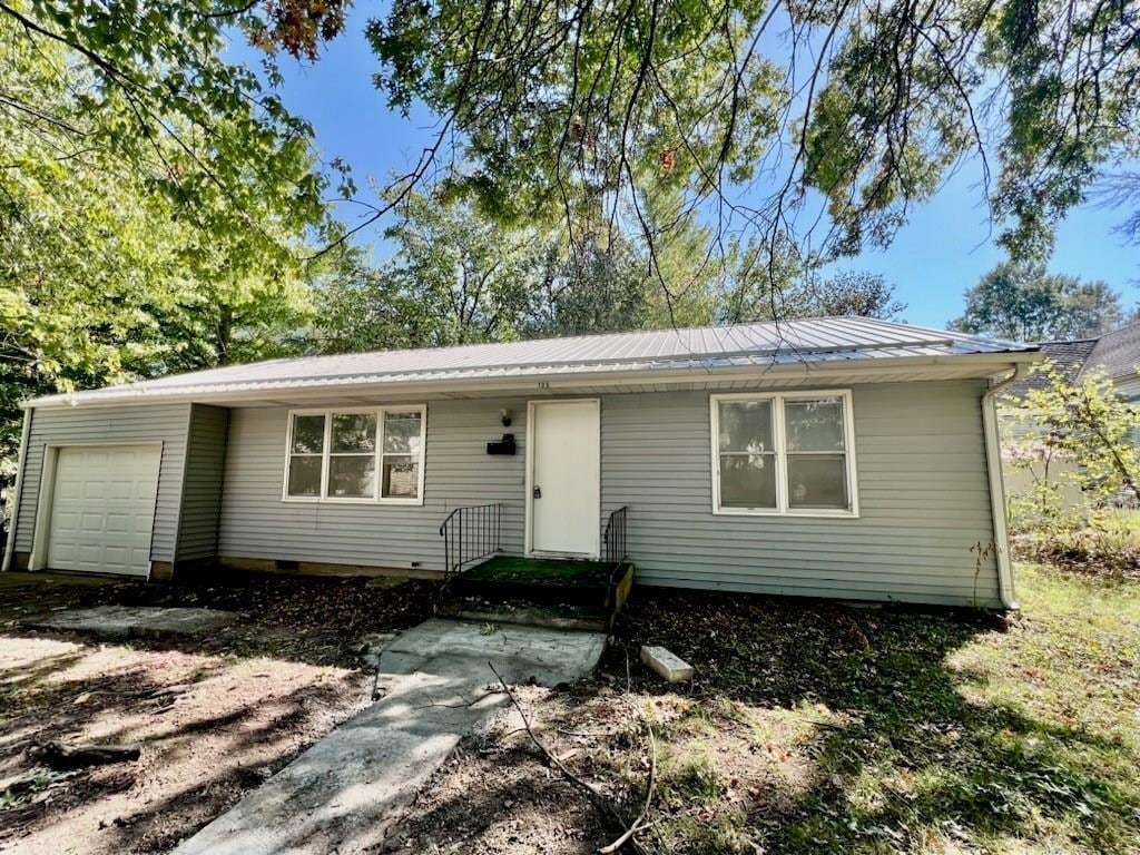 single story home with a garage