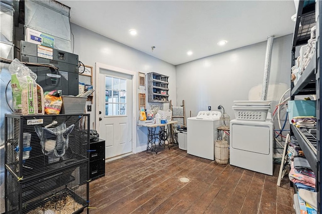 laundry room with dark hardwood / wood-style flooring and washer and clothes dryer