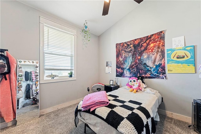 carpeted bedroom with ceiling fan and lofted ceiling