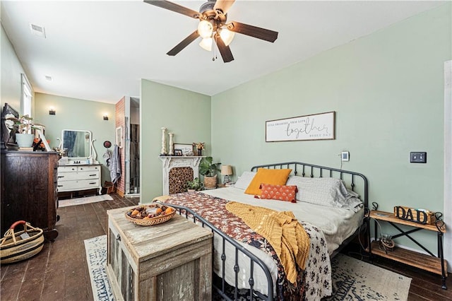 bedroom with ceiling fan and dark wood-type flooring