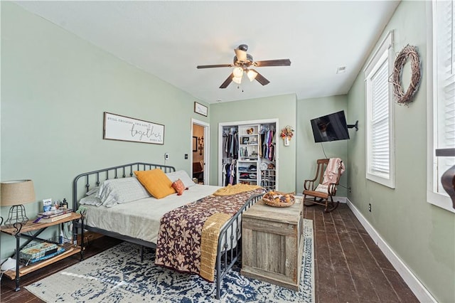 bedroom featuring ceiling fan, a closet, and dark wood-type flooring