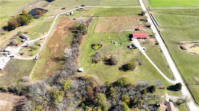 birds eye view of property with a rural view