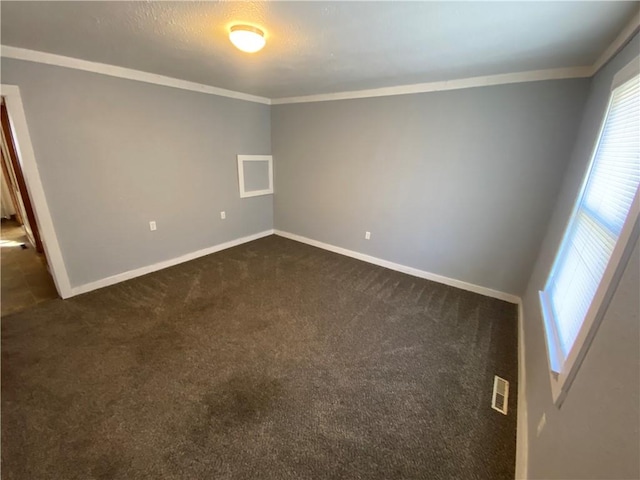 carpeted empty room with ornamental molding