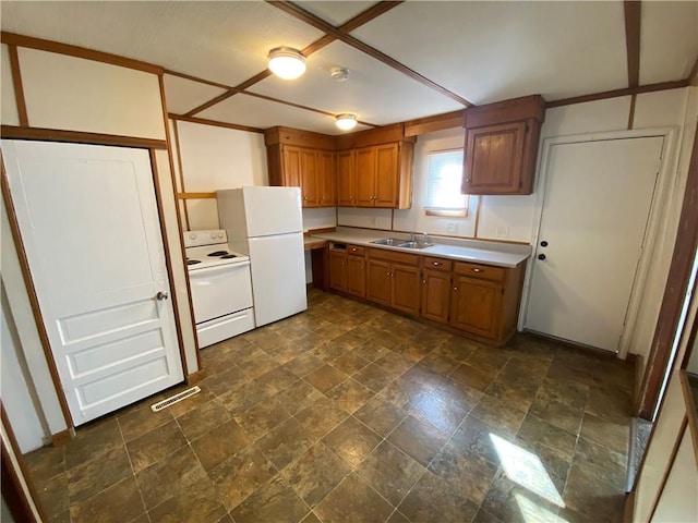 kitchen with white appliances and sink