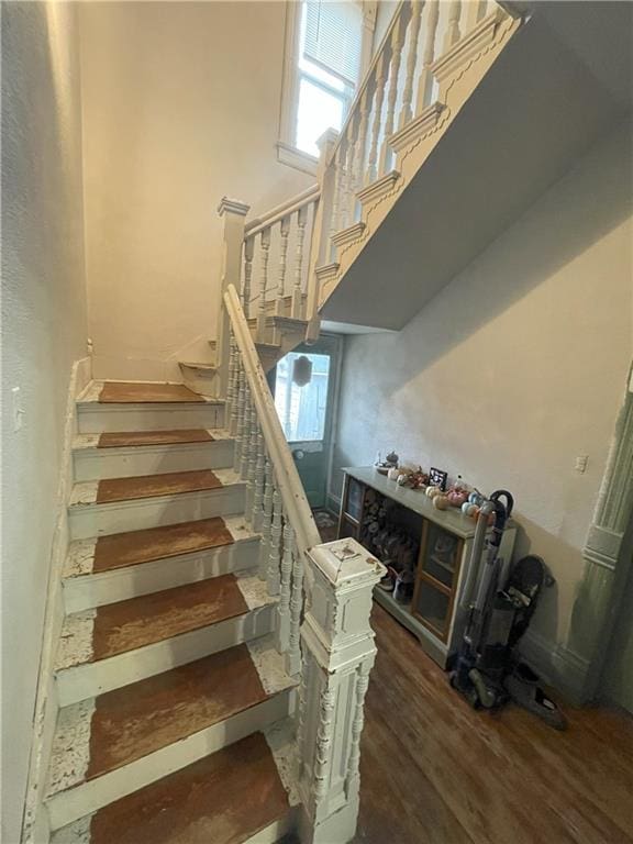 stairs featuring hardwood / wood-style flooring