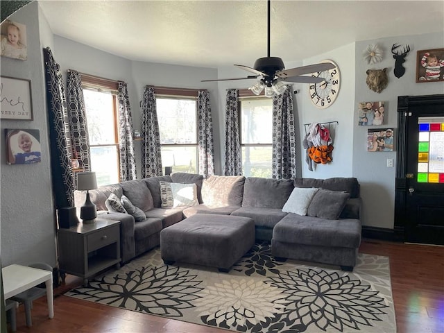 living room featuring hardwood / wood-style flooring and ceiling fan