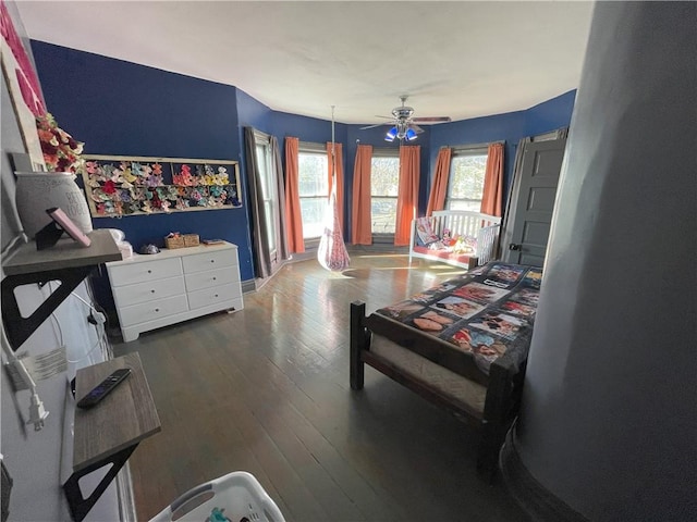 513 W Ohio St, Butler, MO 64730 - bedroom with hardwood / wood-style flooring and a ceiling fan