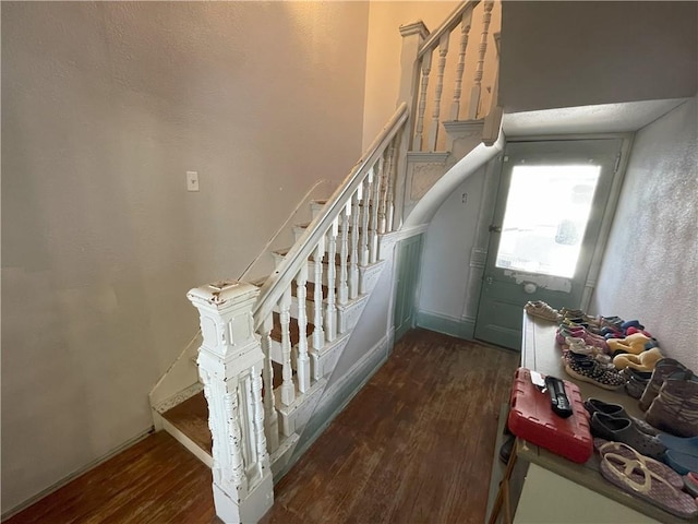 stairway featuring hardwood / wood-style floors