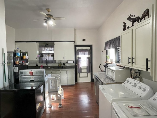 513 W Ohio St, Butler, MO 64730 - kitchen featuring independent washer and dryer, white microwave, ceiling fan, dark wood-style floors, and white cabinetry