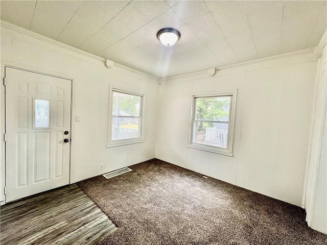 10406 E Lexington Ave, Independence, MO 64053 - foyer with plenty of natural light, crown molding, and dark carpet