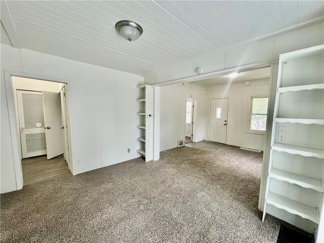 10406 E Lexington Ave, Independence, MO 64053 - unfurnished living room with carpet flooring and wood ceiling