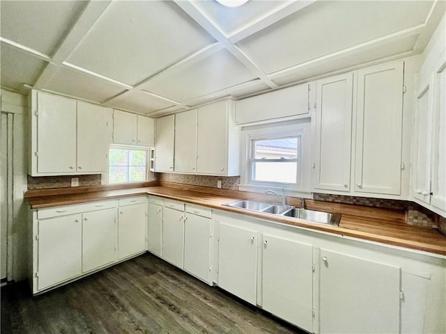 10406 E Lexington Ave, Independence, MO 64053 - kitchen featuring dark wood-type flooring, a sink, white cabinetry, and coffered ceiling