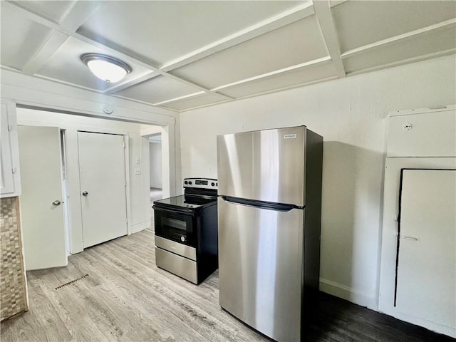 kitchen with coffered ceiling, stainless steel appliances, and light wood-type flooring