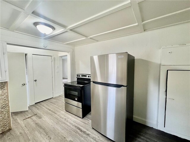 10406 E Lexington Ave, Independence, MO 64053 - kitchen with freestanding refrigerator, black range with electric stovetop, coffered ceiling, wood finished floors, and beamed ceiling