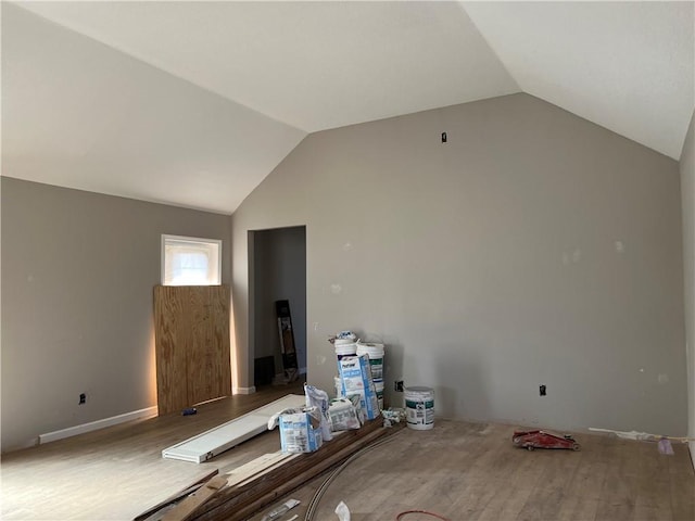 interior space with wood-type flooring and lofted ceiling