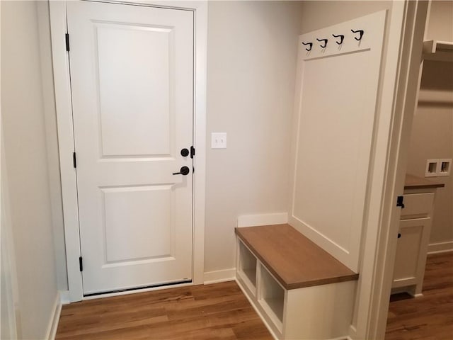 mudroom featuring light wood-style floors and baseboards