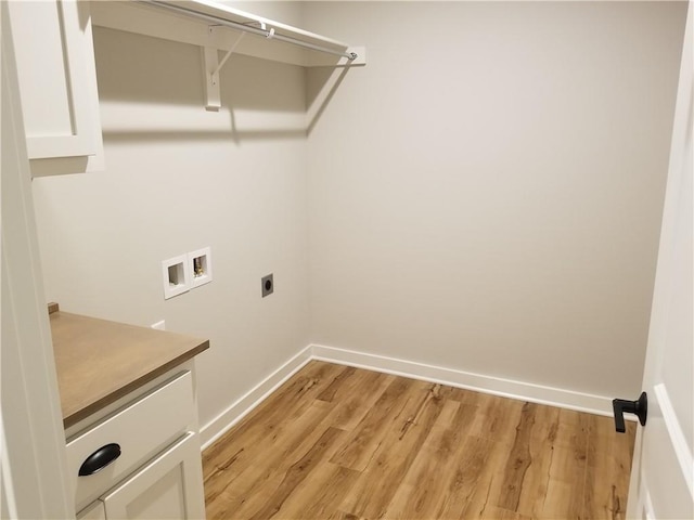 clothes washing area with baseboards, laundry area, hookup for a washing machine, and hookup for an electric dryer